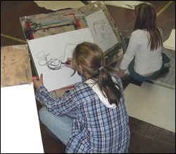 Children painting in Library